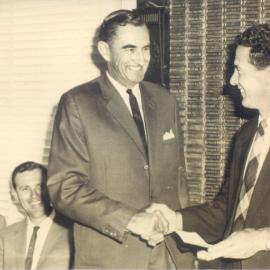 Alex Dan (Shire Clerk), Peter Sharpe (Manager, T.M. Burke), Peter Lightfoot (T.M. Burke) and  Ian Macdonald (Shire Chairman), Chambers, Noosa Shire Council, Pomona, 1964