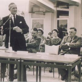Noel Burke (at microphone) and dignitaries, official opening, Peregian Roadhouse, Peregian Beach, 2 June 1962