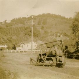 Bulldozer widening the road below Haydens, Noosa Heads, 15 September 1948 