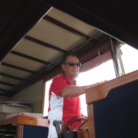 At the helm, Hugh Ramsay, 'Riva Minx', Noosa River, Noosaville, 5 November 2011