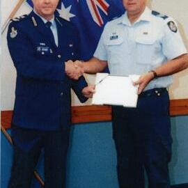 Award presentation, Queensland Police Service, Sergeant Mal Scott (r)