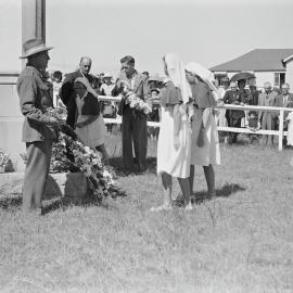 Wreath laying, Anzac Day, Cooroy War Memorial, Diamond Street, Cooroy, 25 April 1949