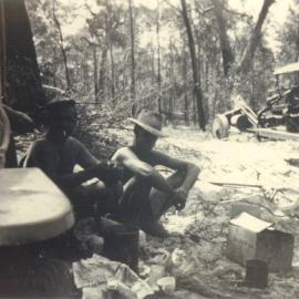 Lunch break, timbergetters Selwyn Beckmann with Ray Gibson, Noosa River, Cooloola, 1950s