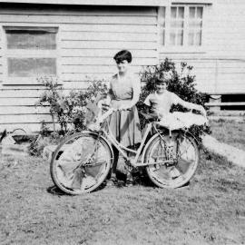 Decorated bicycle, Pat Wood and Joan Wood (l-r), Pine Street, Pomona ca 1950s