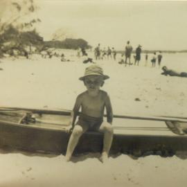 Barry Tedford (child) and beachgoers, Noosa Main Beach, Noosa Heads, 1947-1948