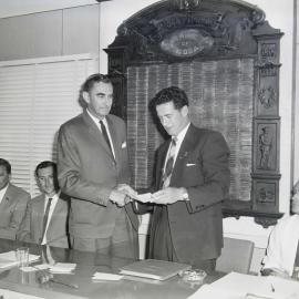 Peter Lightfoot (T.M. Burke) and Ian Macdonald (Shire Chairman)(l-r), Chambers, Noosa Shire Council, Pomona, 1966