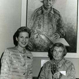 Nancy Cato and Robin Rulli with portrait of Nancy, opening of Cato's Restaurant, ca 1989