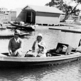 Family group departing Parkyn's jetty in dinghy, Tewantin 