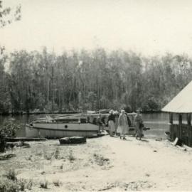 Passengers arriving  'Restdown' landing , Lake Cooroibah, 1952