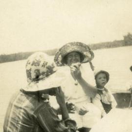 Boating party, Polly Greber (centre) 