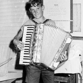 Accordion player, New Year's Eve party, Kirriwina Motel and Caravan Park, Gympie Terrace, Noosaville, 31 December 1969