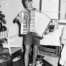 Accordion player, New Year's Eve party, Kirriwina Motel and Caravan Park, Gympie Terrace, Noosaville, 31 December 1969
