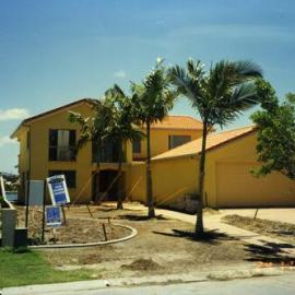 Canal home with transplanted palm trees, Noosa Waters, Noosa Heads, 1990s