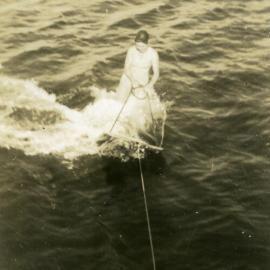 Emy, aeroplaning behind 'Miss Laguna II', Gympie Terrace, Noosaville, 10 September 1950