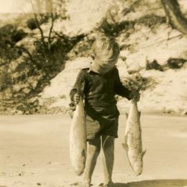 Child with 2 mullet, Little Cove, Noosa Heads, 6 June 1949