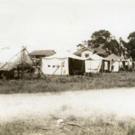 Collins family home (far right behind tree) and tents, Noosaville, ca 1960s