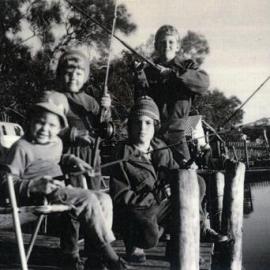 Brett, Ricky, Wayne and Gary Grice, (l-r), fishing from jetty, Weyba Creek, Noosaville, 1970