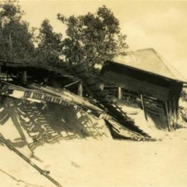 Damaged Ladies and Men's dressing sheds after cyclone,  Noosa Main Beach, Noosa Heads, 21 February 1954