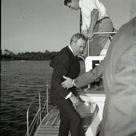 Wally Rae, Minister for Local Government, boarding the Cooloola Queen (Everglades Tours), Parkyn Boat Wharf, Tewantin, 21 June 1971