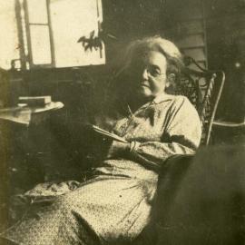 Elderly woman enjoying her book, ca 1920s