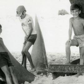Children on propeller of Cherry Venture, Teewah Beach, ca 1983
