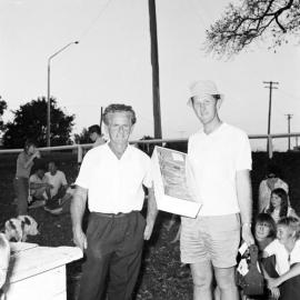 Cr Ned Earl (l) and prize-winner,  Tewantin, August 1971