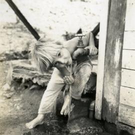 Carl Freeman, quenching his thirst, ca 1970s