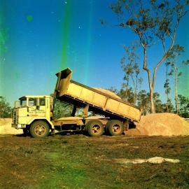 Dump truck, land development, Weyba Creek,  Noosaville,  23 August 1972