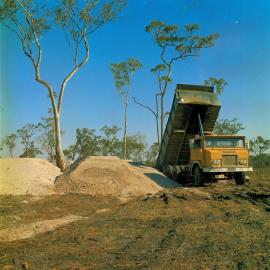 Dump truck, land development, Weyba Creek,  Noosaville,  23 August 1972